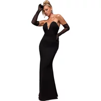 Black strapless Goddiva maxi dress with deep neckline, fitted silhouette, and long black gloves.