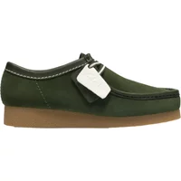 Green suede Clarks WallabeeEVO loafers with tan crepe sole and white stitching.