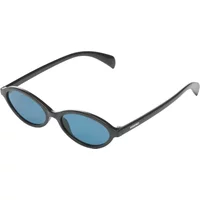 Black Komono Doris sunglasses with oval blue lenses and sleek black frames.