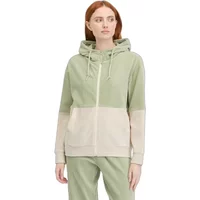 Green and beige color-block zip-up hoodie with drawstring hood, worn by a woman.