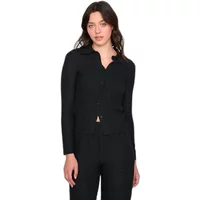 Black textured blouse with long sleeves, button-up front, and collared neckline worn by a woman.