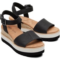 Black TOMS Diana Wedge sandals with ankle strap, espadrille detailing, and thick white platform sole.