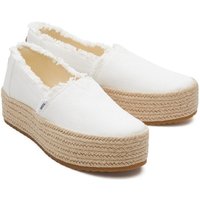 White TOMS Valencia espadrille with frayed edges, jute-wrapped platform sole, and slip-on design.