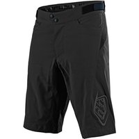 Black Troy Lee Designs Flowline MTB shorts with adjustable waistband and logo on the left thigh.
