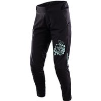 Black Troy Lee Designs Lilium women's MTB trousers with turquoise geometric patterns on thighs and sleek tapered fit.