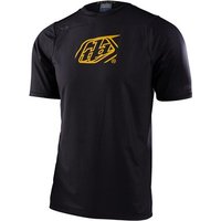 Black Troy Lee Designs Skyline MTB jersey with yellow logo on chest, short sleeves, and breathable fabric.