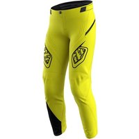 Yellow Troy Lee Designs Sprint Youth MTB trousers with black accents and logo on thighs.
