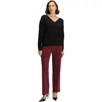 Black V-neck viscose pullover by Greenpoint, long sleeves, paired with burgundy pants.