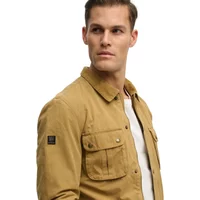 Tan Superdry Burford jacket with buttoned chest pockets, collar, and Superdry logo patch on sleeve.