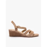 Beige suede wedge sandals with ankle strap and crisscross design by Ryłko.