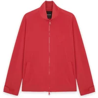Red Lyle & Scott windbreaker with high collar, front zipper, and side pockets.
