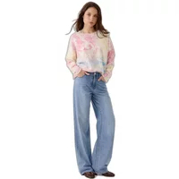 Cream and pink tie-dye sweater by Artlove Neolia, long sleeves, relaxed fit, paired with light blue wide-leg jeans.