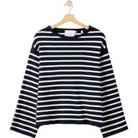 Navy and white striped Holebrook Lissie sweater with long sleeves and crew neck on wooden hanger.