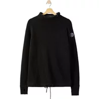 Black Holebrook Martina sweater with high collar, drawstring hem, and logo patch on sleeve.