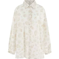 White Guess Elara women's shirt with leaf pattern, long sleeves, and button-down front.