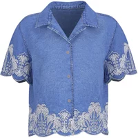 Blue denim short-sleeve shirt with white lace embroidery and scalloped hem.