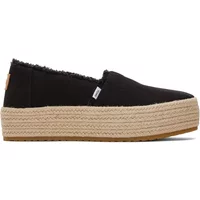Black women’s platform espadrilles by TOMS with woven jute sole and frayed edges.