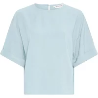 Light blue women's blouse by Moss Copenhagen, short sleeves, round neckline, and back button closure.