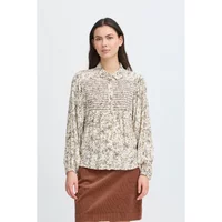 Cream floral blouse with pleated front and button-down collar by Atelier Rêve, long sleeves, worn by a model.