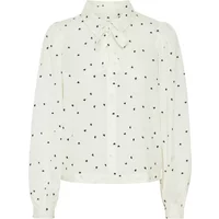 White women's blouse with black polka dots, long sleeves, and a tie-neck detail by Atelier Rêve.