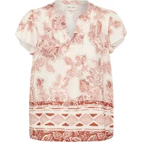 Cream Jessie women's blouse with floral pattern, short sleeves, V-neck, and decorative border at hem.