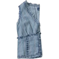 Sleeveless Guess Rebeca blouse with ruffled edges, light blue denim fabric, and button-down front.