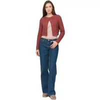 Red cropped women's cardigan with button closure, worn over a light top, paired with blue jeans.