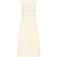 Cream sleeveless dress by Atelier Rêve with lace bodice and knee-length skirt.