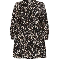 Black and white patterned women's dress by KAFFE Curve with long sleeves and a cinched waist.