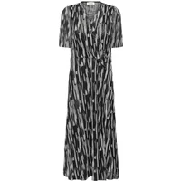 Black and white patterned women's dress with short sleeves and V-neck by Soaked in Luxury.