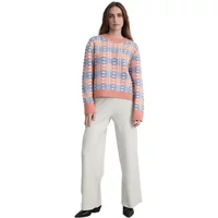 Cream women's fluid cut trousers, wide-leg fit, paired with a pastel plaid sweater.