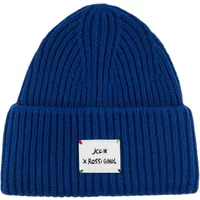 Blue ribbed knit women's hat with folded brim and Rossignol logo patch.