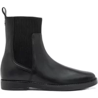 Black leather Chelsea boots with elastic side panels and flat sole.