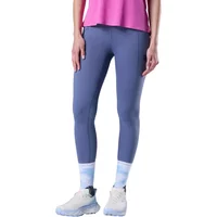 Blue Rossignol Sapa women's leggings, full-length, worn with pink top and white sneakers.