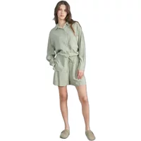 Light green women's linen shorts with elastic waistband and drawstring, paired with matching long-sleeve shirt.