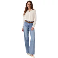 White long sleeve shirt by Artlove Davia, button-up design, paired with light blue jeans and brown belt.