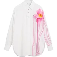 White Desigual long sleeve shirt with pink floral design on the side and button-up collar.