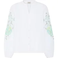 White women's long sleeve shirt with floral patterns on sleeves and a button-up front.