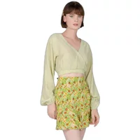 Light green women's long-sleeved wrap shirt by 24 Colours, featuring a cropped fit and balloon sleeves.