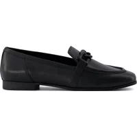 Black TOMS Lynett women's moccasins with a low heel and decorative bow detail.