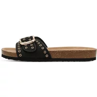 Black Tamaris women's mules with wide strap, silver buckle, eyelet details, and cork sole.