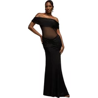 Black off-the-shoulder Goddiva maxi dress with ruched bodice and sheer midsection.