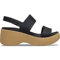 Black platform sandals with tan sole, adjustable ankle strap, and open toe design.