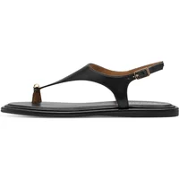 Black Tamaris women's sandals with thong strap, gold buckle, and flat sole.