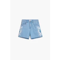 Light blue women's shorts Desigual Wakanda with tribal patterns and button closure.