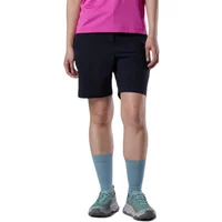 Black women's Rossignol Stretch 7" shorts, knee-length, worn with pink top, blue socks, and sneakers.