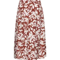 Rust-colored floral print women's skirt, knee-length, with white leaf patterns by KAFFE Curve.