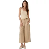 Cream women's tank top Artlove Auranea with thin straps, paired with beige wide-leg pants.