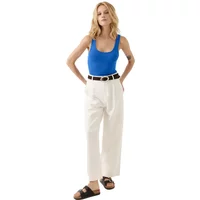Blue Artlove Cyrilla women's tank top, sleeveless with scoop neckline, paired with white pants and black sandals.