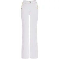 White women's trousers Guess Faye with flared legs and gold button details on the hips.